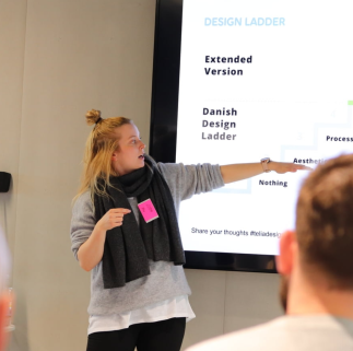 Lotta Salminen presenting the design maturity models. -- Image credit: Tommi Luhtala