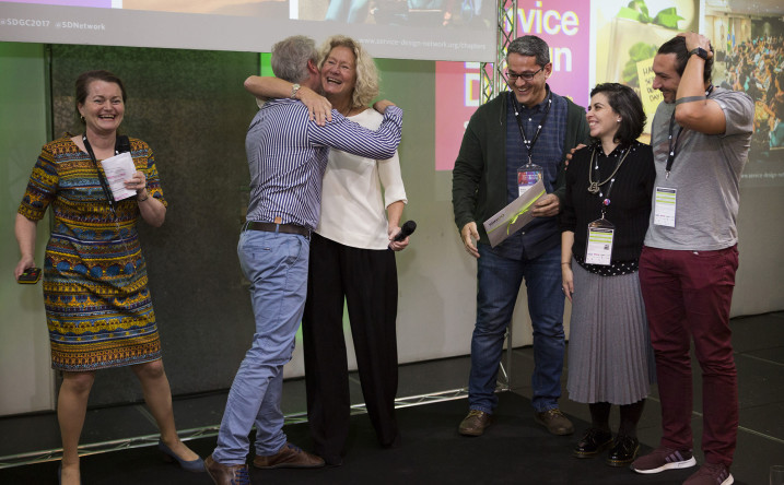 One of the winning chapters, SDN Brazil, collect their winner certificate on stage during the Award Ceremony at SDGC17